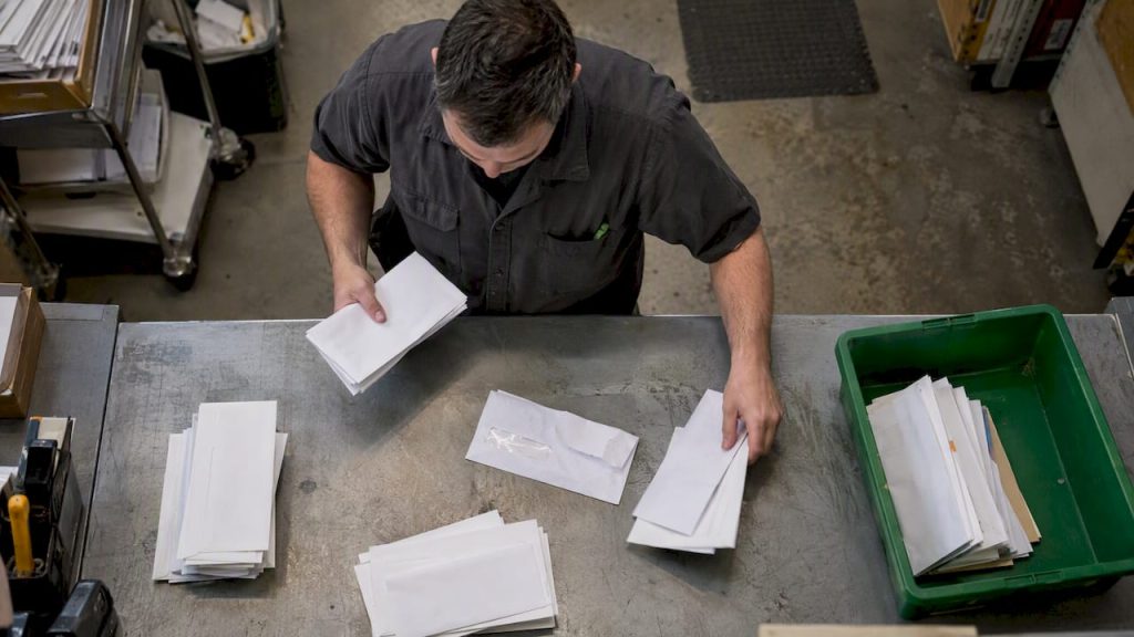 Duplicate and returned mail pieces being sorted